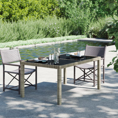 alt="Garden Table 150x90x75 cm Tempered Glass and Poly Rattan Grey"